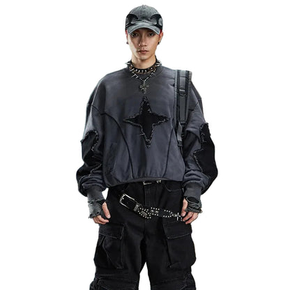 VOIDWEAR SIGNAL_BURR_07 ☰ long sleeve worn in Berlin underpass; star patchwork visible across chest, matte lighting accentuating texture