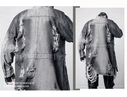 VOIDWEAR VDR_SIGNAL_07 Ritual Jacket — distressed long denim coat with ripped holes, glyph detailing, and loose high-street fit.. Ripped denim jacket shown from the back with a plain background