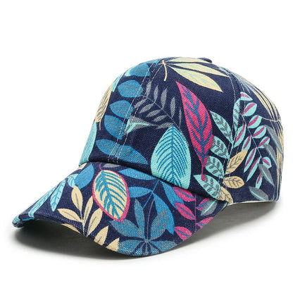 SIGNAL_VANISH_06 Cap | VOIDWEAR Ritual-Inspired Streetwear. Navy blue cap with colorful leaf pattern on a white background