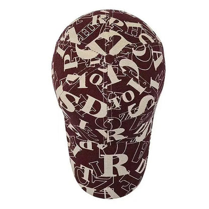Maroon head cover with beige letter pattern on a white background